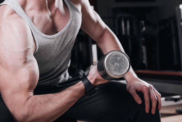 muscular man working out gym doing exercises with dumbbells biceps close up 435174 3895